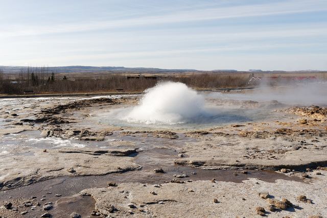 Strokkur geyser erupting in the Geysir geothermal field, Haukadalur, Iceland